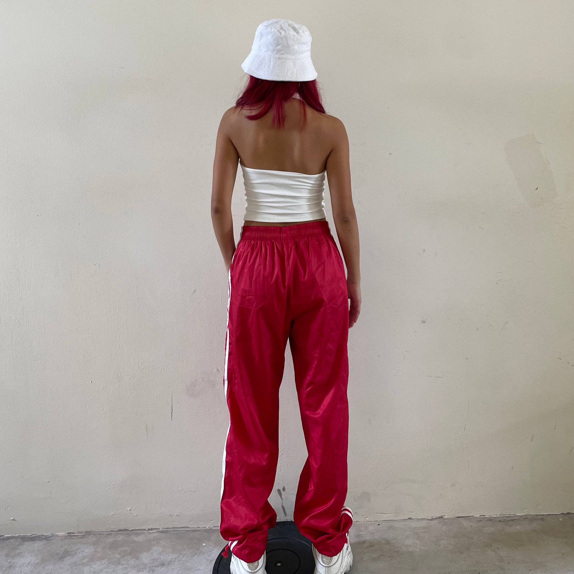 Red and white striped 2025 track pants